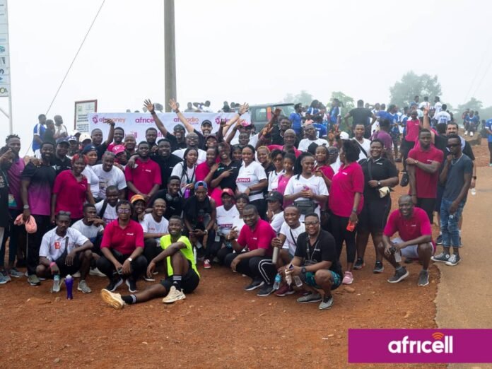 By Alusine Joseph Mansaray. The Africell Health and fitness walk was well attended by staff from various parts of the country as they started from the Africell headquarter at Wilberforce and designated to Leicester Peak on Saturday the 20th May 2023. Addressing the gathering at the finished point, the Chief Cooperate Affairs Manager of Africell Jose Abass Bangura said every employer knows that the most important assets to any company are their employees as the ultimate goal employers want from employees is to reach maximum productivity levels and in a quest to accomplish such supporting fitness is one of the most beneficial choices any employer can make to encourage their workers to reach their full potential. Joe Abass Bangura furthered that as a company they decided to organize the Africell health and fitness walk to improve employees’ health and wellness, reduce healthcare costs, and increase engagement and job satisfaction. Also, Joe Abass Bangura said during the health and fitness work the management of Africell provided some first aid treatments and as well vehicles for those whom might get hurt during the work but however thank God there was no casualty during the process. Mr. Bangura continued that this initiative will help employees not to get sick easily as when an employee uses less sick days, they contribute more to overall productivity and reduce the hassle of trying to find replacements at the last minute. He added that employees who are fit creates a sense of confidence, which allows them to set higher goals and to always strive for excellence and as well encouraging exercise is a good way to promote teamwork which encourages personal growth, increases job satisfaction, and reduces stress during and after work. On his path, the Media Manager of Africell, John Konteh said as a company they decided to embark on lots of sporting activities like the health and fitness walk, the LELEMU inter-departmental football tournament, the Sports meet and the Africell Freetown marathon as a way to keep their workers fit physically and psychologically which help reduces employees’ stress levels as a good exercise has the phenomenal ability to lessen the amount of stress felt from physical and emotional tensions in life. John Konteh furthered it is obvious that employees who are not stressed are more focused as they contribute to a much higher level of productivity. Similarly, John Konteh said that involving in sport helps you stay in shape, teaches you how to organize your time, boosts friendships, and builds relationships with your peers and adults in and outside place. John Konteh added that as a company they are very passionate about sports as there are lots of empirical evidences of their support to some of these sporting disciplines such as football, volleyball, crickets as the list goes on. John Konteh continued that the Africell inter-departmental LELEMU tournament will commence on Sunday the 28th May 2023 at the SS camp X-tray Arena and therefore called on their valued subscribers to witness football at its best as they have talented players which have the skills and enthusiasm to play football. John Konteh concluded by thanking all those that made it humanly possible to attend this epoch-making Africell health and fitness walk initiative. The Africell health and fitness work was climax with a group photos and merriments in a quest to show gratitude for making this event a success. Africell is the leading telecommunications company in Sierra Leone that has invested in various sectors in the country such as entertainment, education, health, infrastructure etc. and as well gives local talents the platforms they deserve by bringing them to a wider audience.